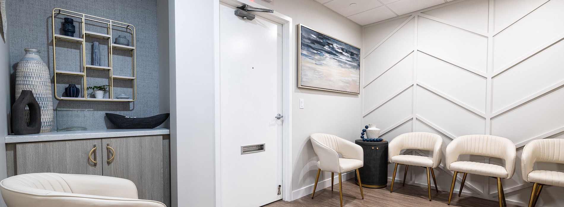 Waiting room with modern furniture and a clean, professional aesthetic.